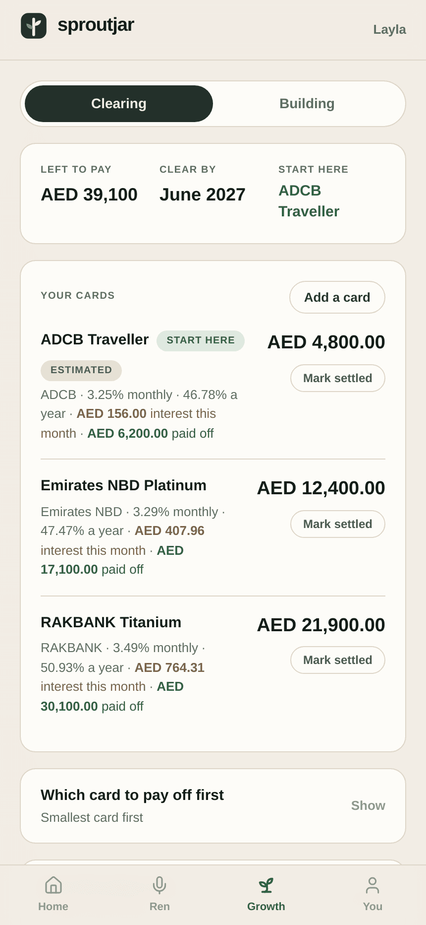 Plan, then called Growth: a clearing and building toggle, three cards with balances, monthly and annual rates, interest this month, and amounts paid off.